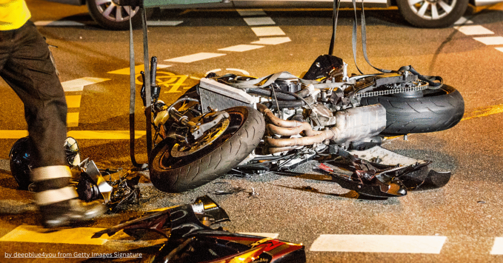 2 wheeler third party insurance – damaged motorcycle after road accident showing need for liability coverage.