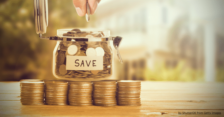 How to save money from salary – jar of coins with savings label and stacked coins for financial planning.