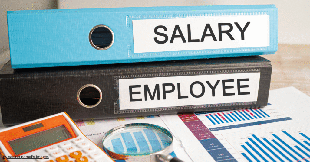 Difference between salary account and savings account – salary documents, employee files, and calculator on financial reports.